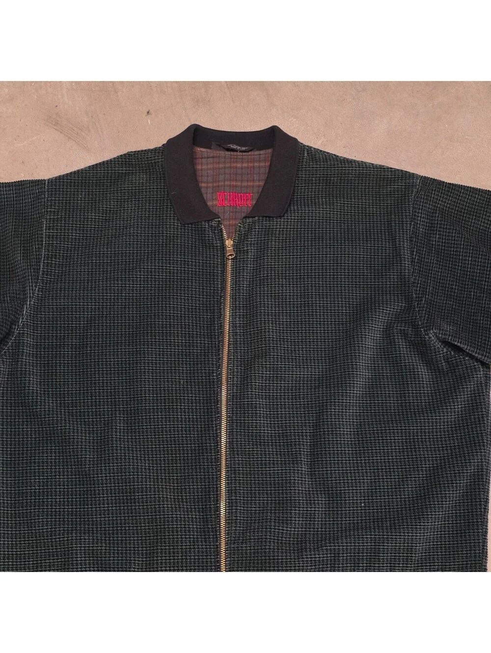 Schroff corduroy jacket features a distinctive green checkered pattern 25x34
